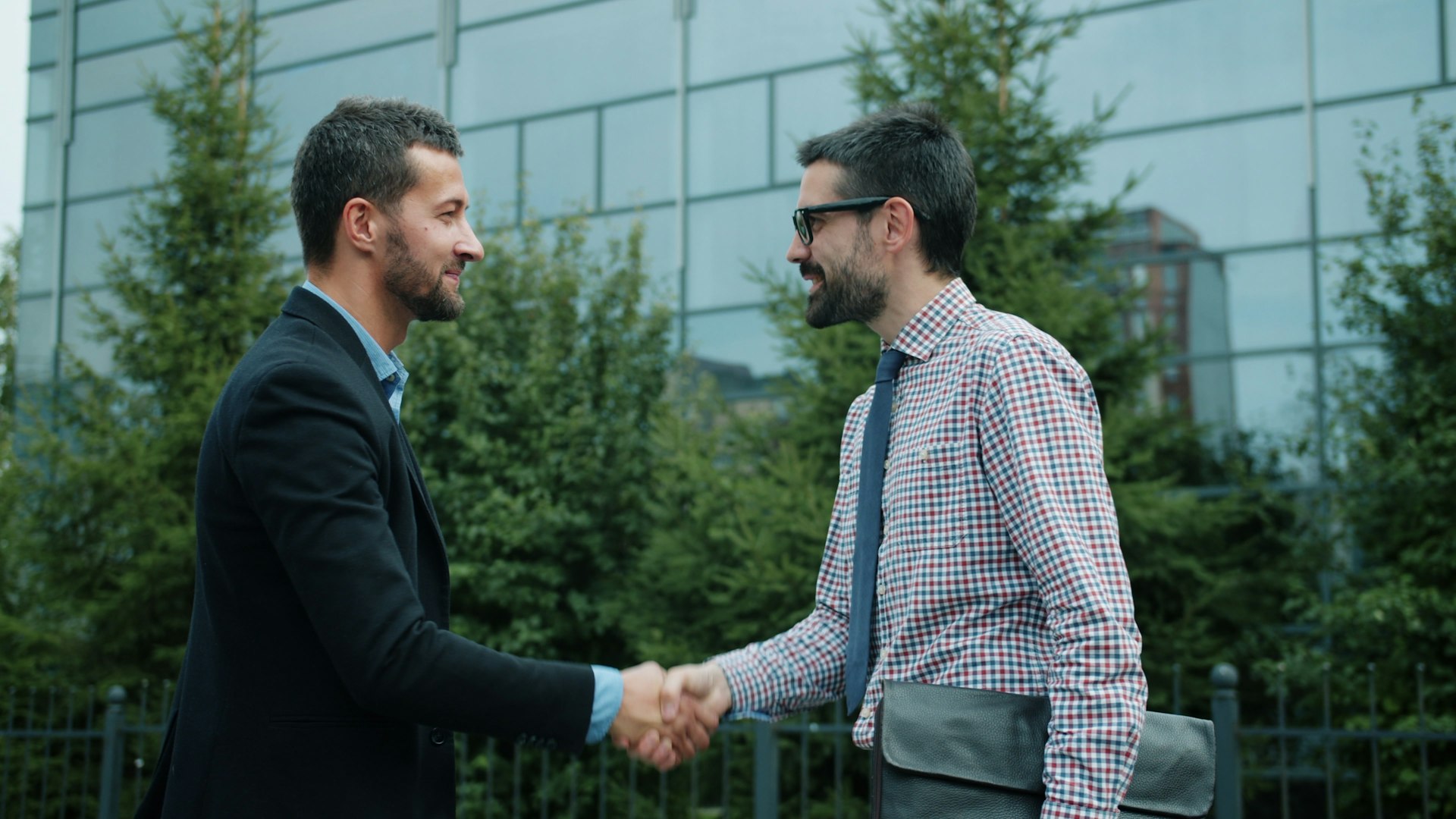 Strategic business partnership handshake representing global industrial advisory collaboration